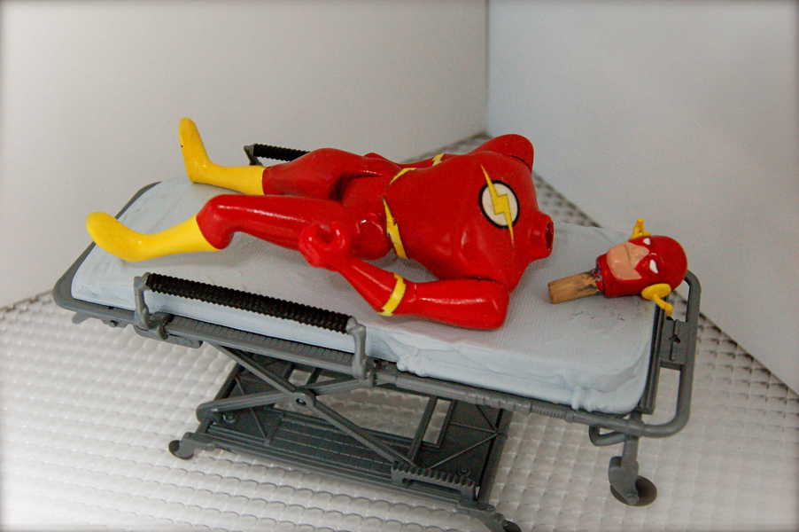 Photo of the superhero Flash at the hospital with his head detacted