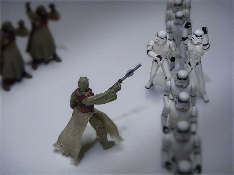 Photo of sand people instructing stormtroopers to walk single file